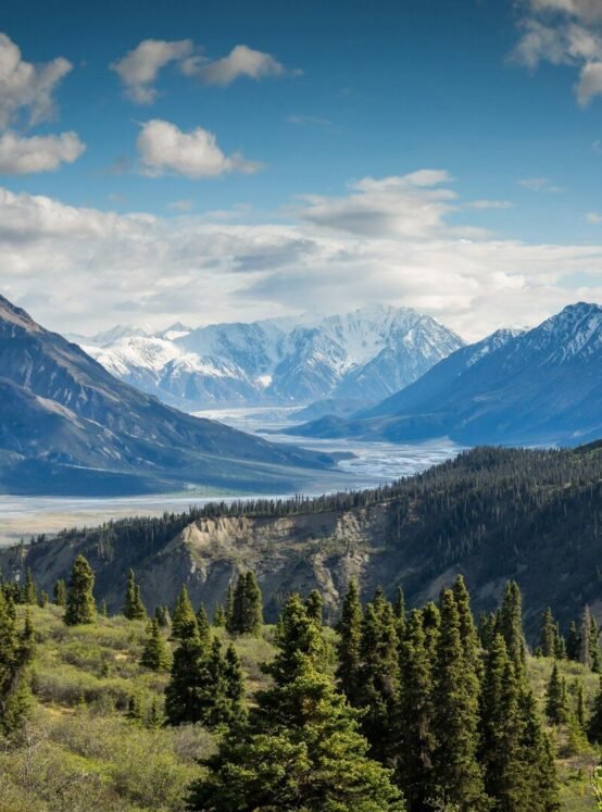 green mountain across body of water